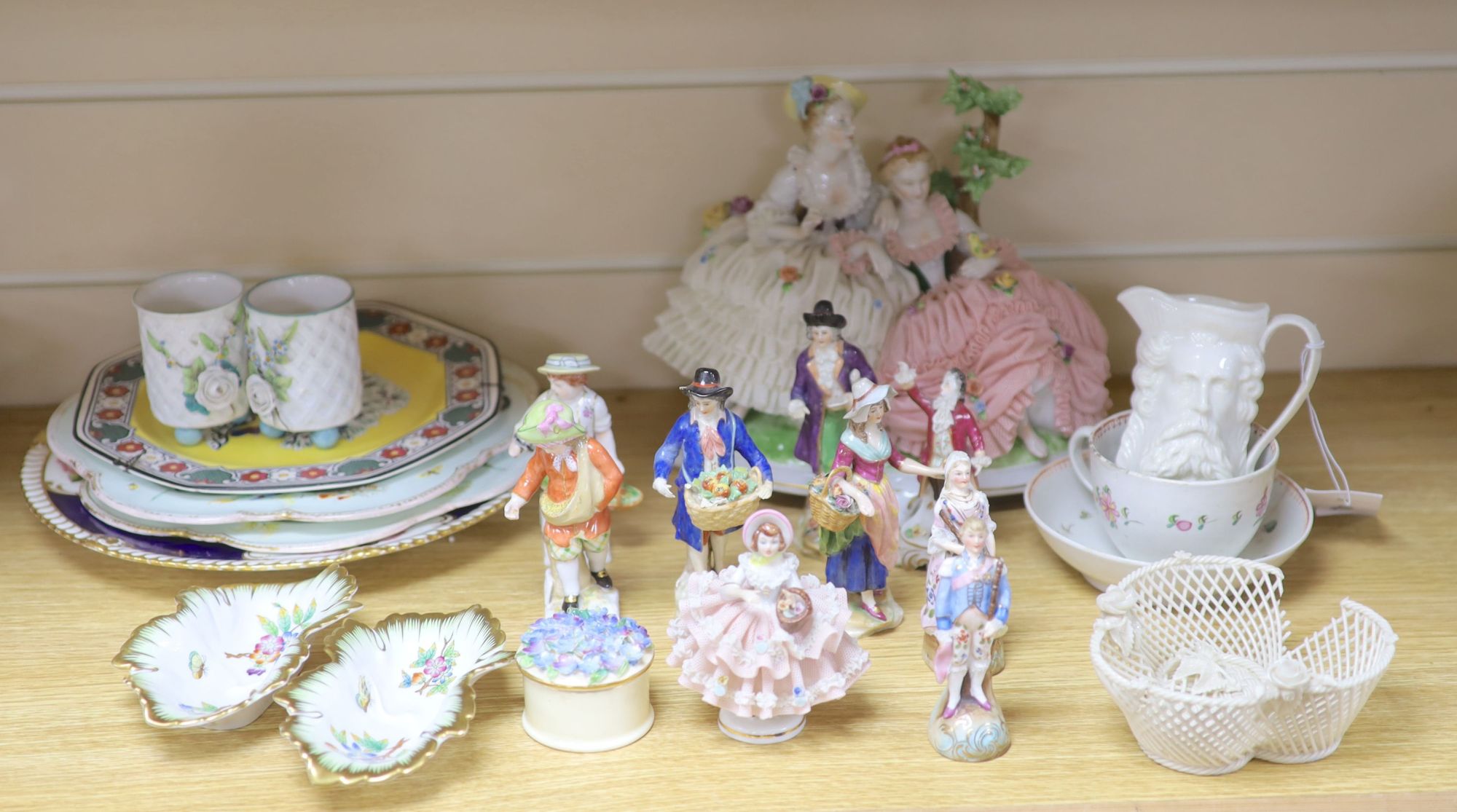 A group of Continental porcelain figures and groups, largest 20cm high and various plates, dishes etc.